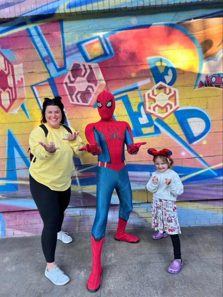 Rachel and her daughter enjoying characters in Disney