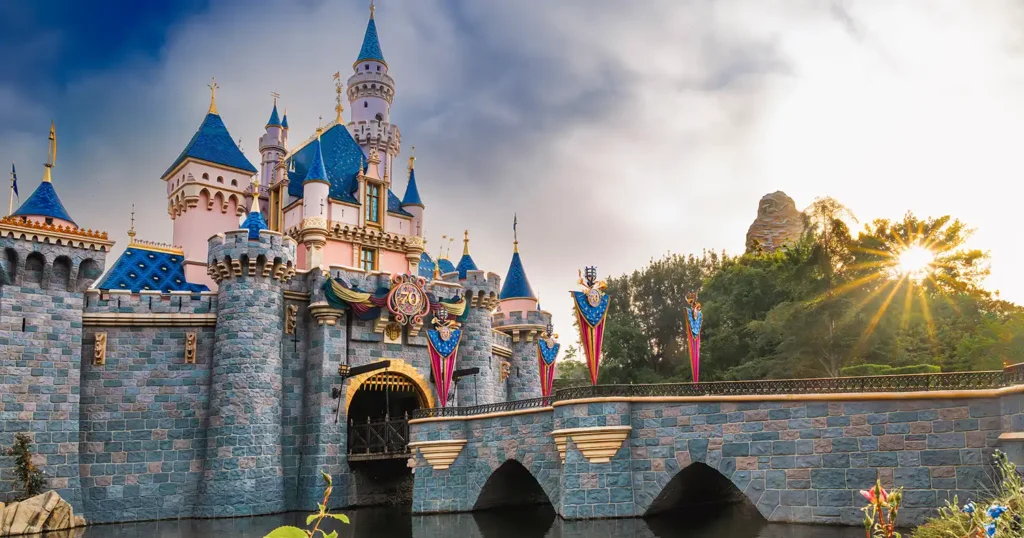 First-time Disney traveler feeling overwhelmed comparing Disneyland vs Disney World trip planning
