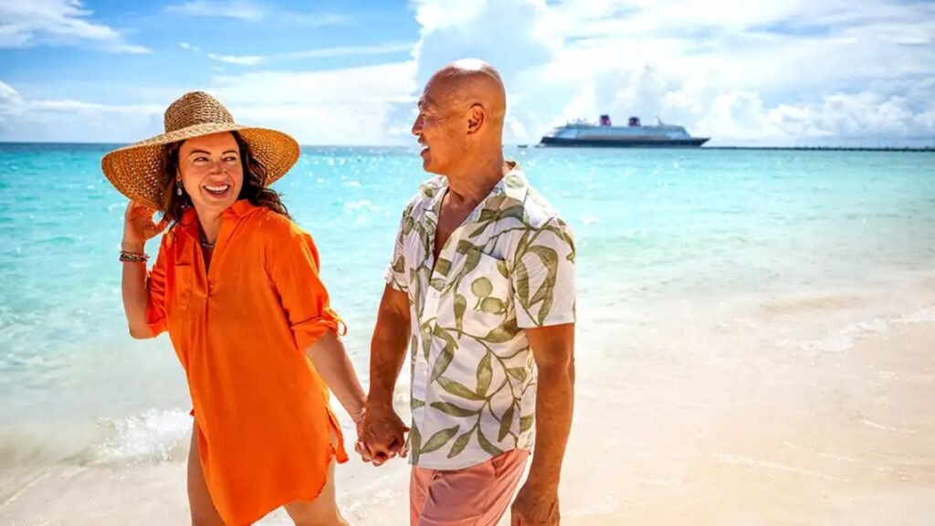 Couple walking on the beach in Lighthouse Point, Bahamas with Disney Cruise Line