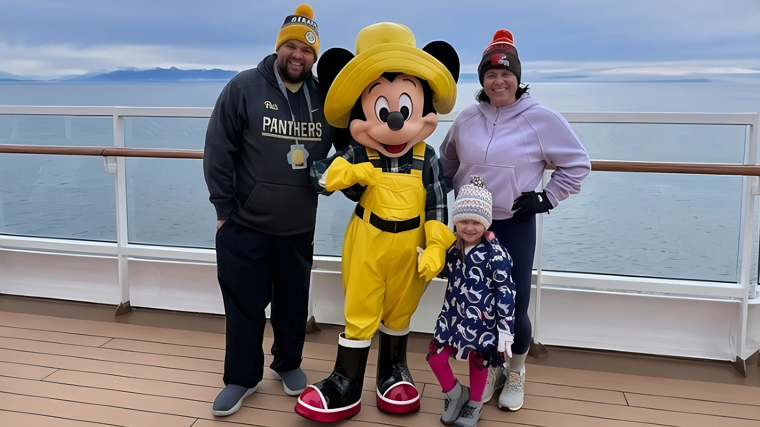 Family meeting Mickey Mouse on a Disney Alaska cruise ship during an unforgettable Alaska vacation.